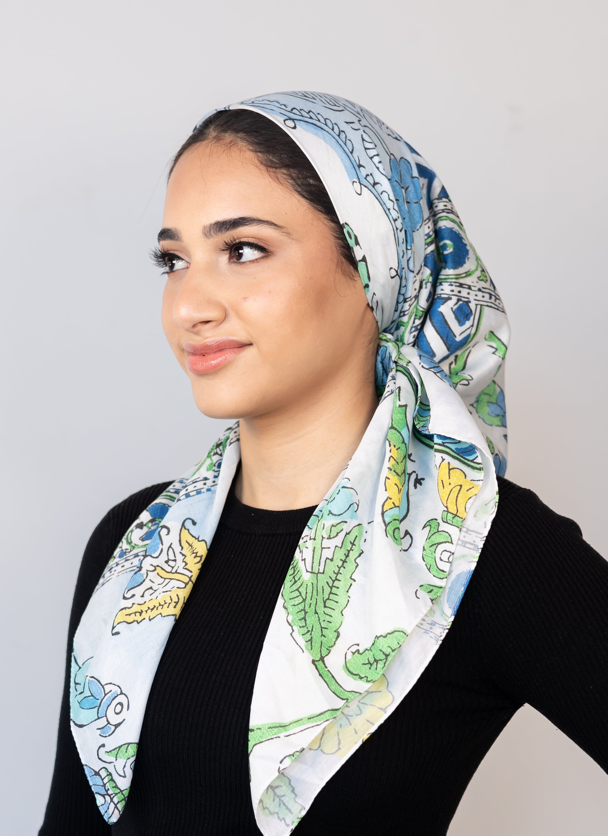 Bold floral print reminiscent of hand-painted Italian ceramics or countryside blossoms.