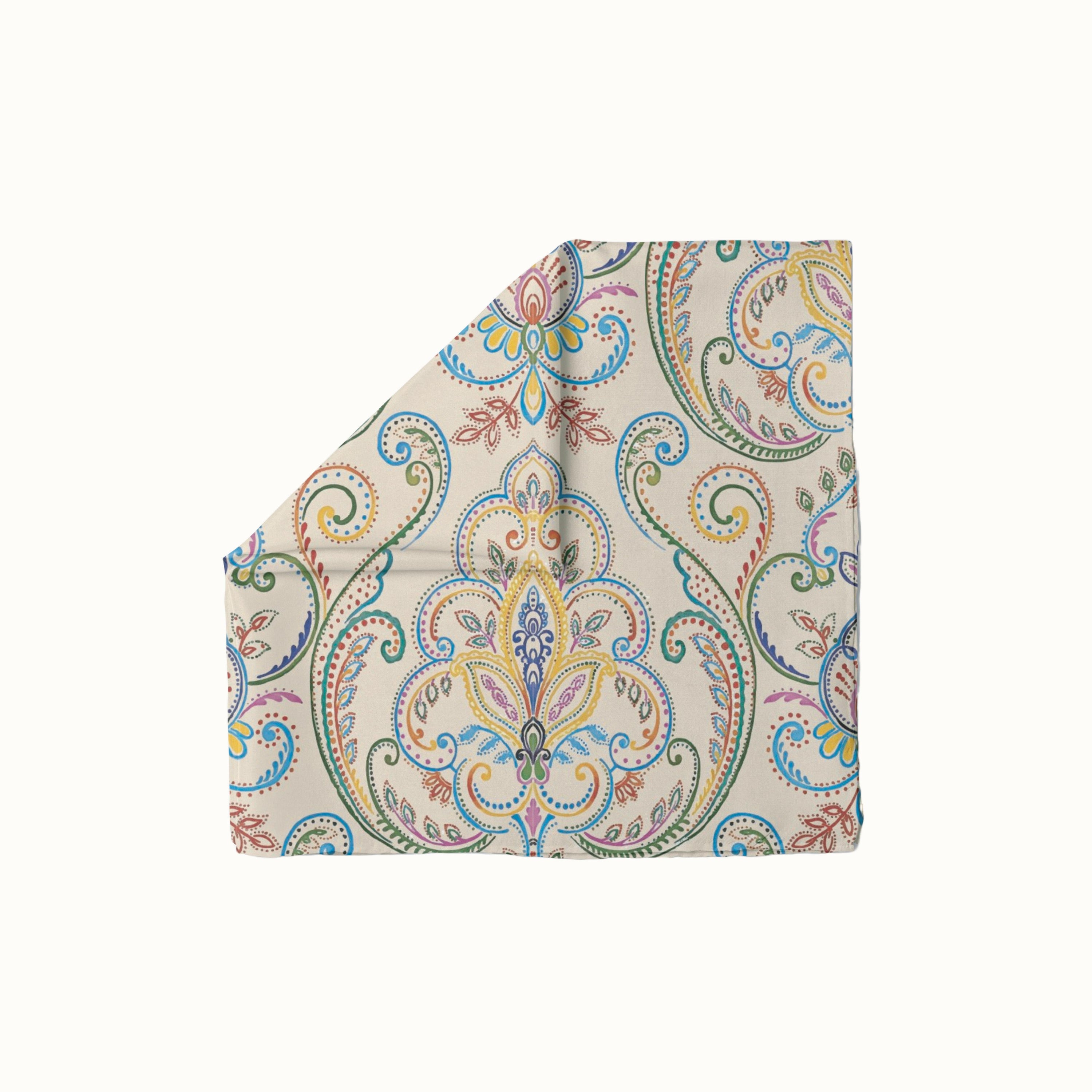 Paisley Whirl headscarf with colorful paisley and floral motifs on blush pink background, boho-chic women’s fashion accessory for all seasons