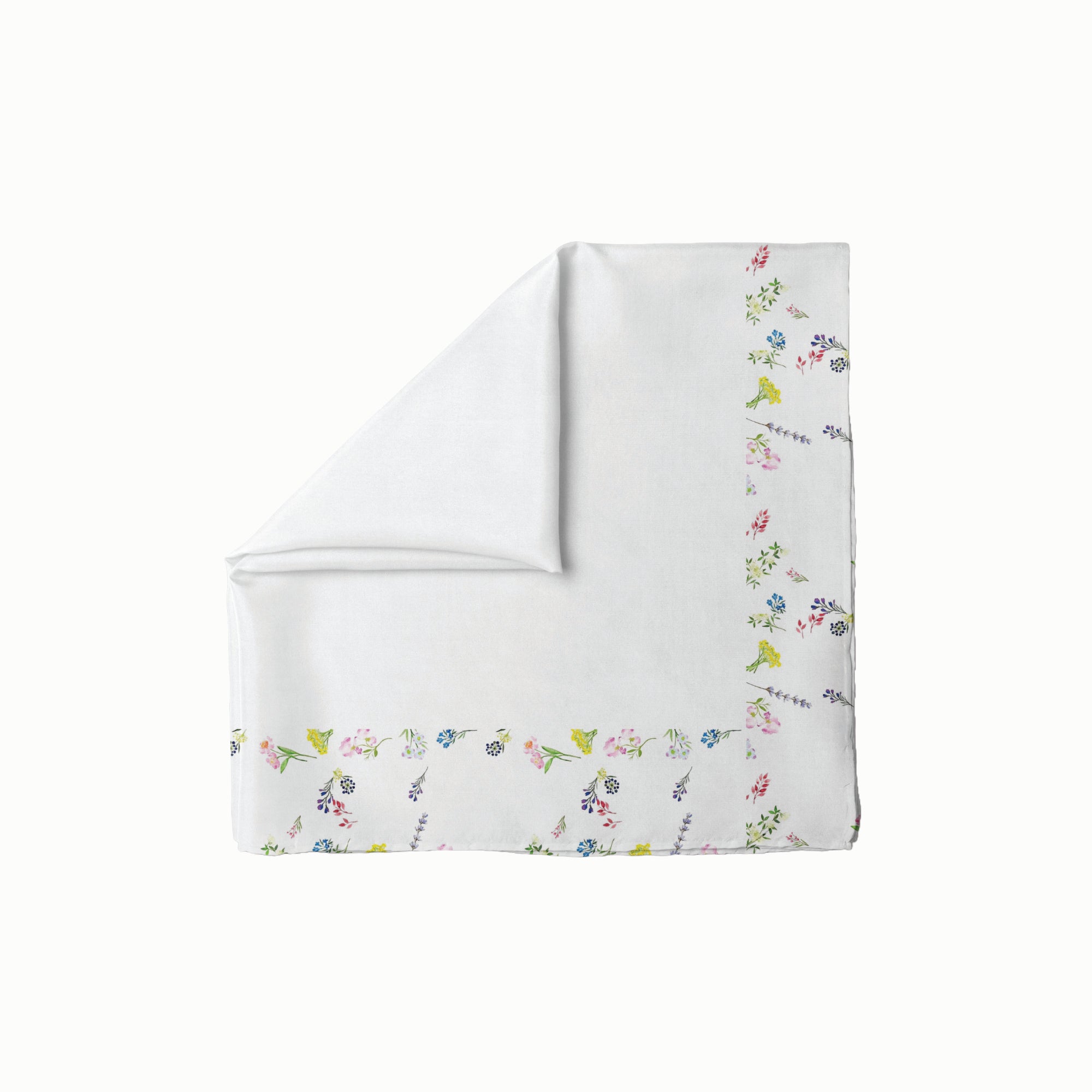 White head scarf with delicate multicolor floral border design, folded neatly with one corner turned down.