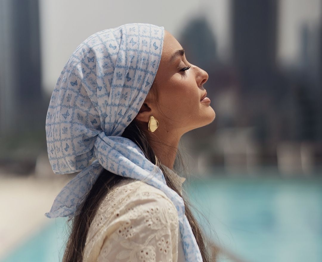 Model wearing a clean tichel from Tie Ur Knot