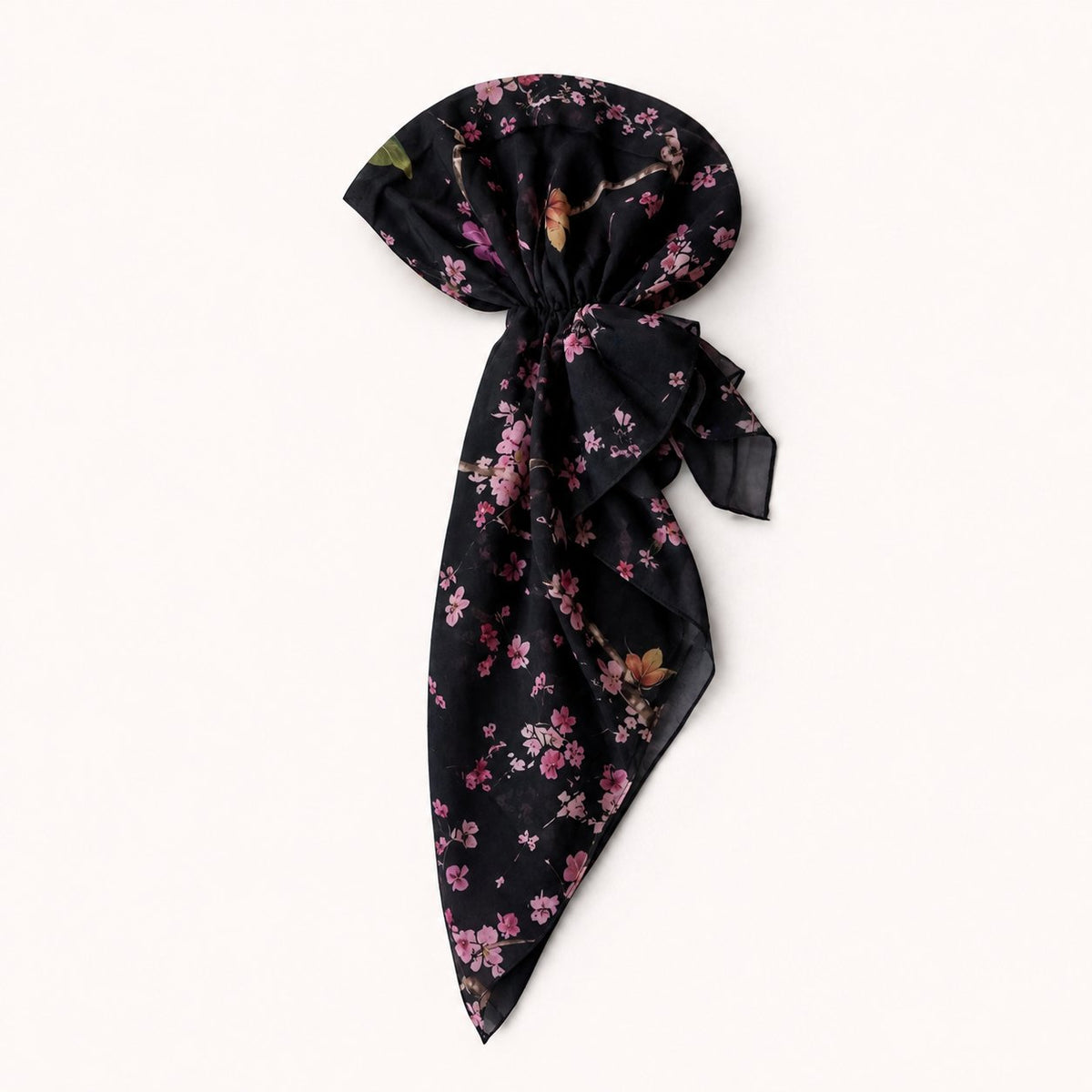 TUK After Bloom Head Scarf in black, pre-tied with flowing tails, featuring delicate pink cherry blossoms and butterfly details.