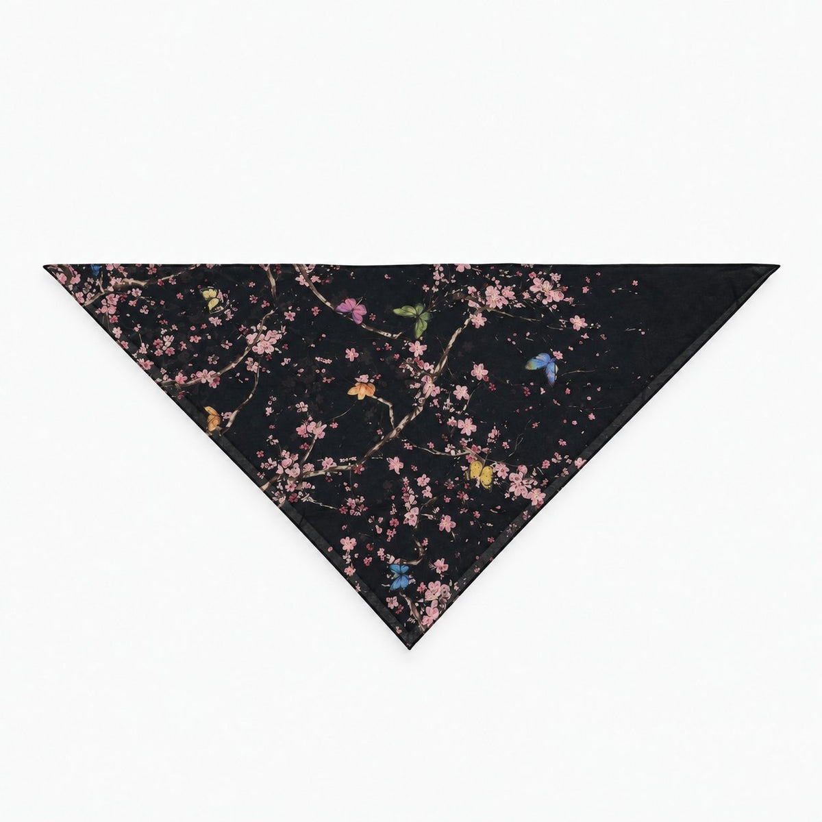 TUK After Bloom Head Scarf folded into a triangle, featuring pink cherry blossoms, colorful butterflies, and branches on black.