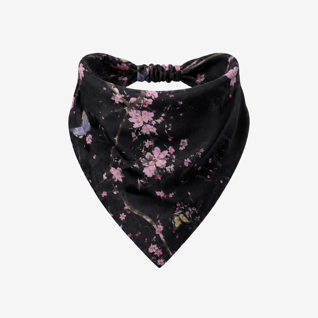 TUK After Bloom Headband Bandana in black with delicate pink blossoms, floral branches and butterfly accents with an elastic back.