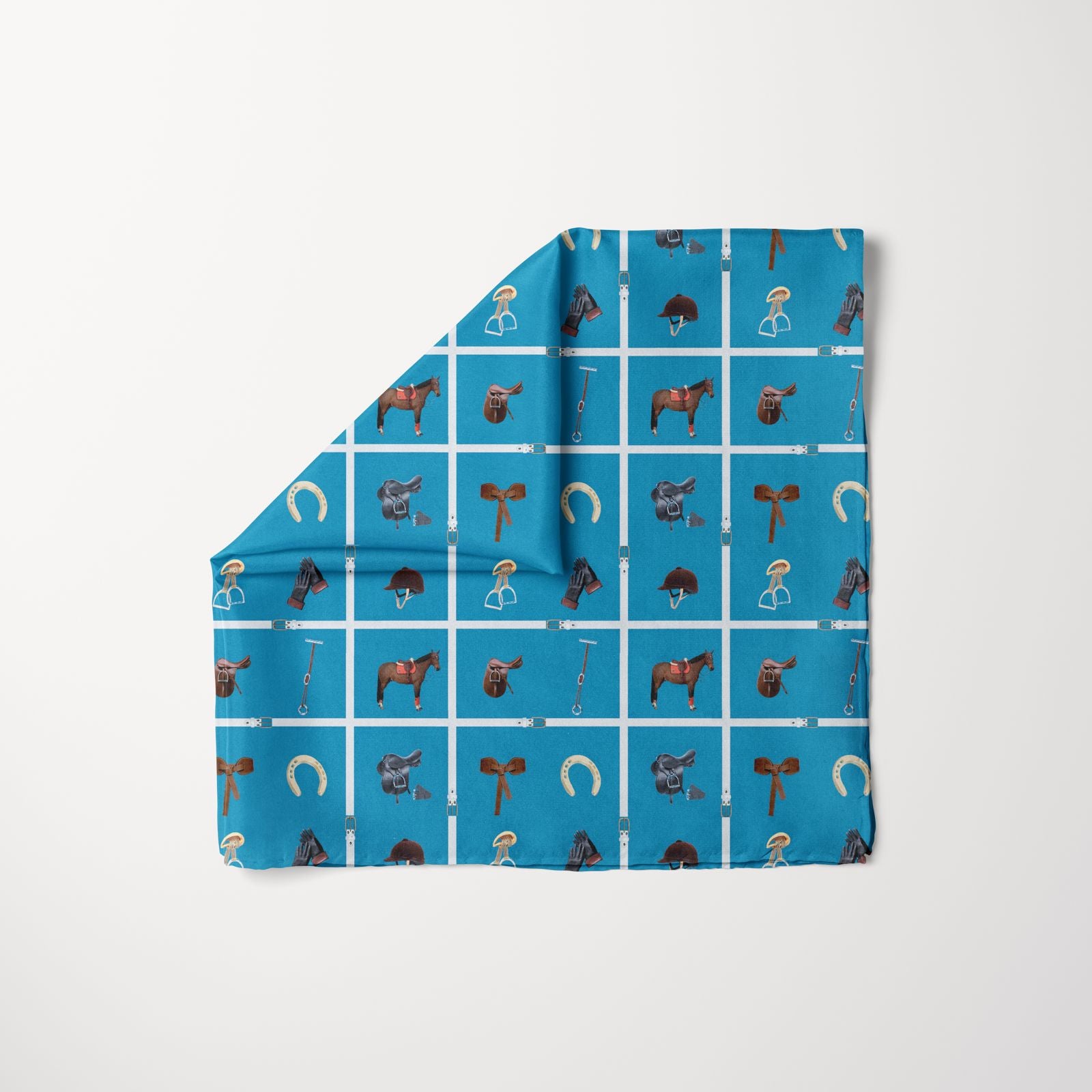 A blue square scarf with a grid pattern featuring equestrian-themed illustrations, including horses, saddles, riding helmets, gloves, horseshoes, stirrups, and bridles.