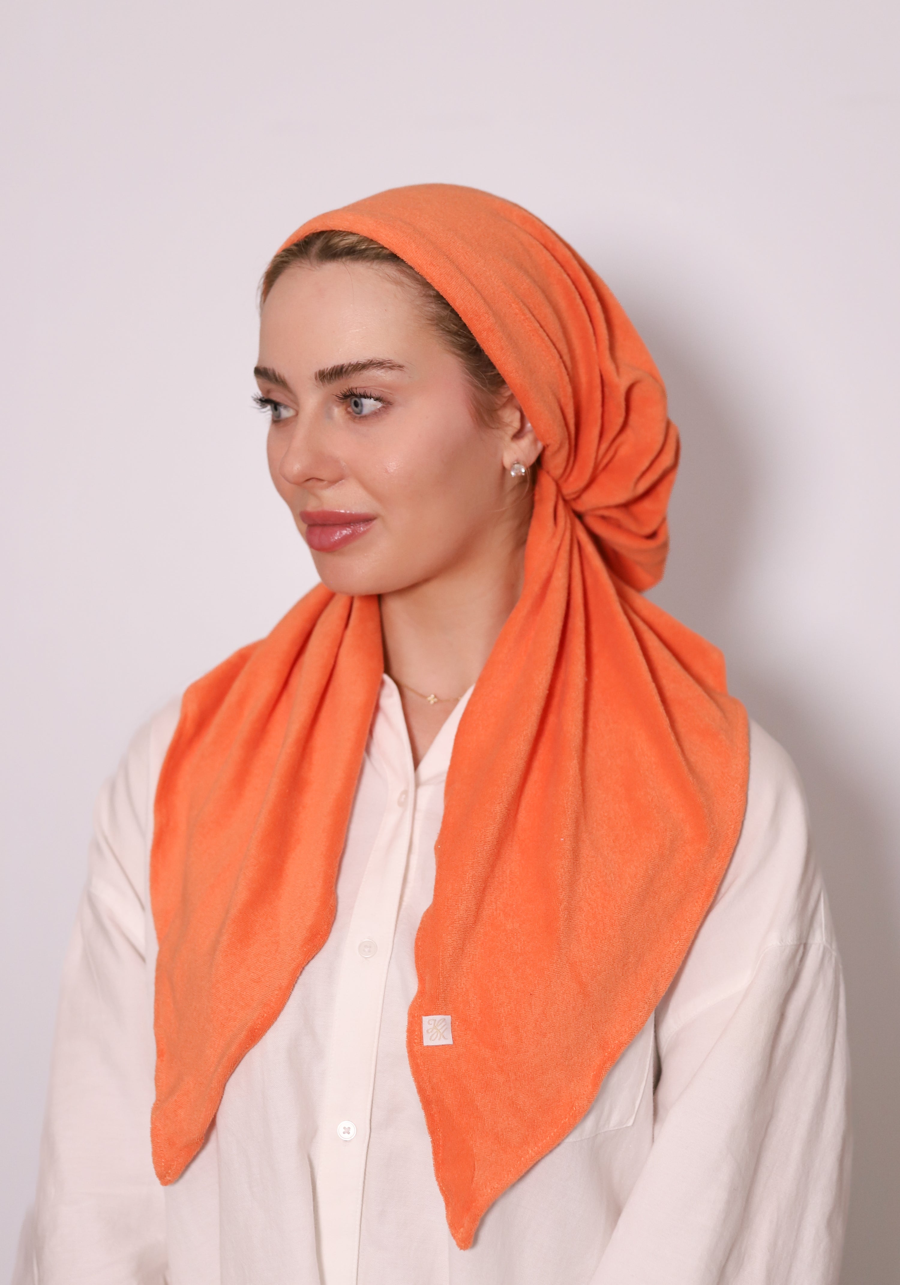 Burnt Orange Terry Head Scarf by TUK in soft terry fabric, styled as a modest headscarf with elegant drape and vibrant color.