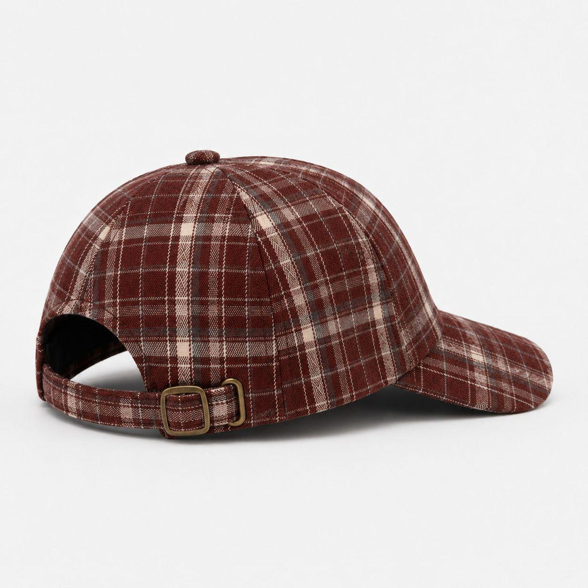 Back view of TUK Crimson Check Heritage Plaid Cap in red and cream plaid with adjustable brass buckle strap and curved brim.