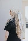 The result is a graceful and airy accessory perfect for spring picnics, casual chic days, or feminine finishing touches. 