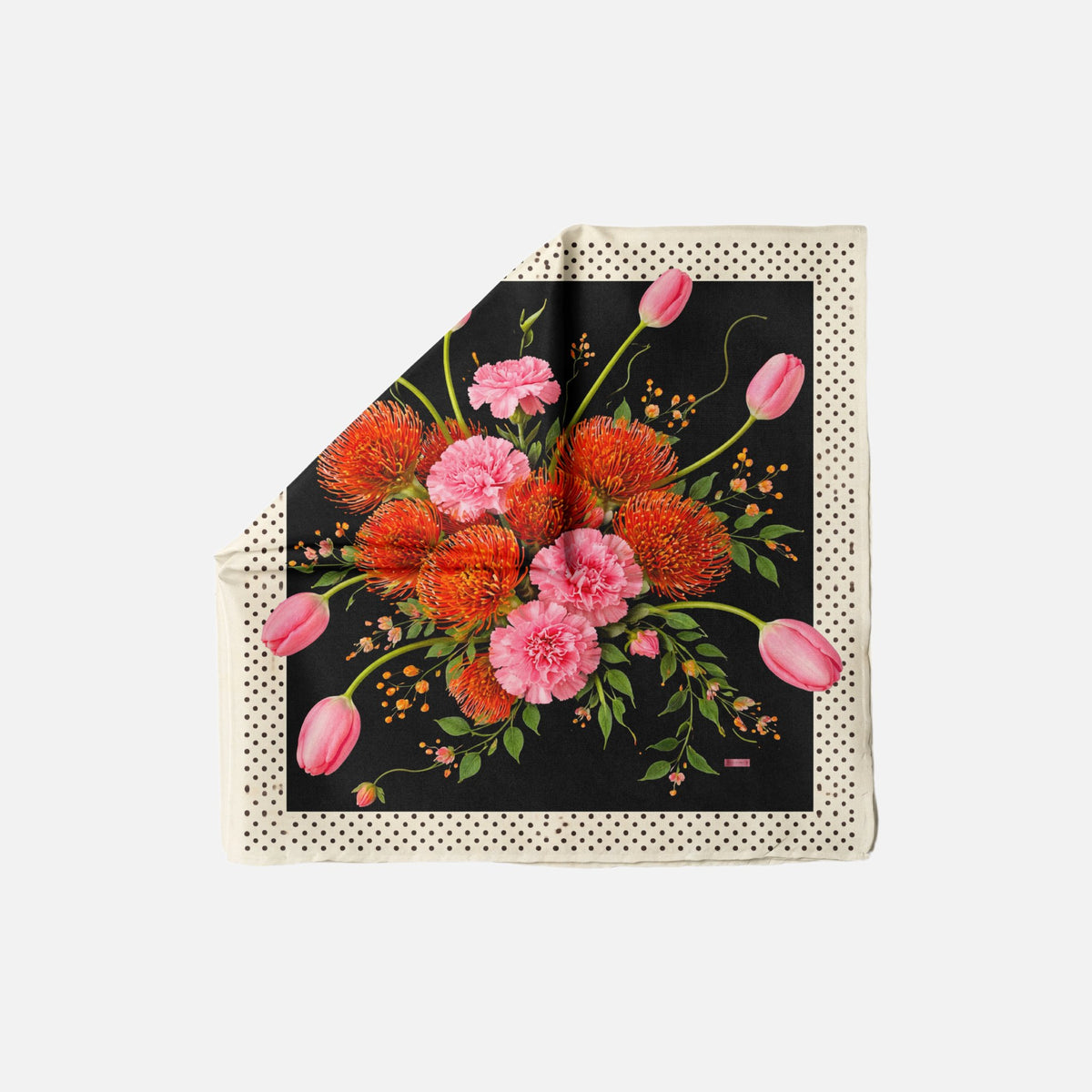 TUK In Full Swing Head Scarf features vibrant orange and pink florals on a black background with a cream polka dot border.