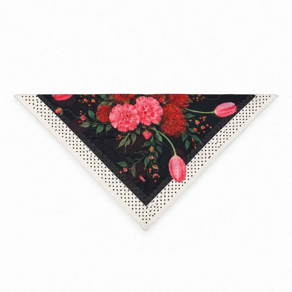 TUK In Full Swing Head Scarf folded into a triangle, featuring pink and orange florals on black with a cream polka dot border.