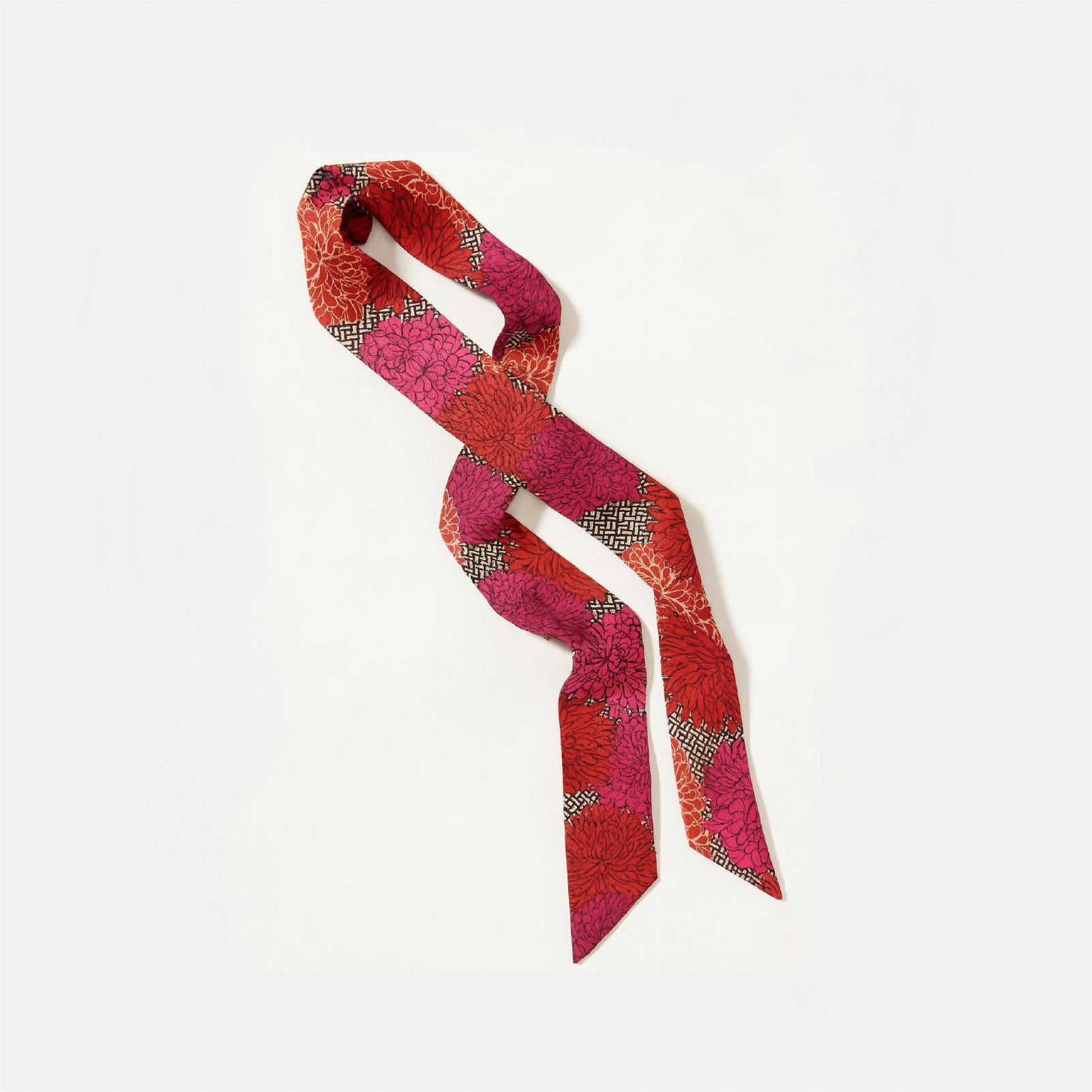 Statement ribbon accessory with saturated floral tones