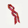 Statement ribbon accessory with saturated floral tones
