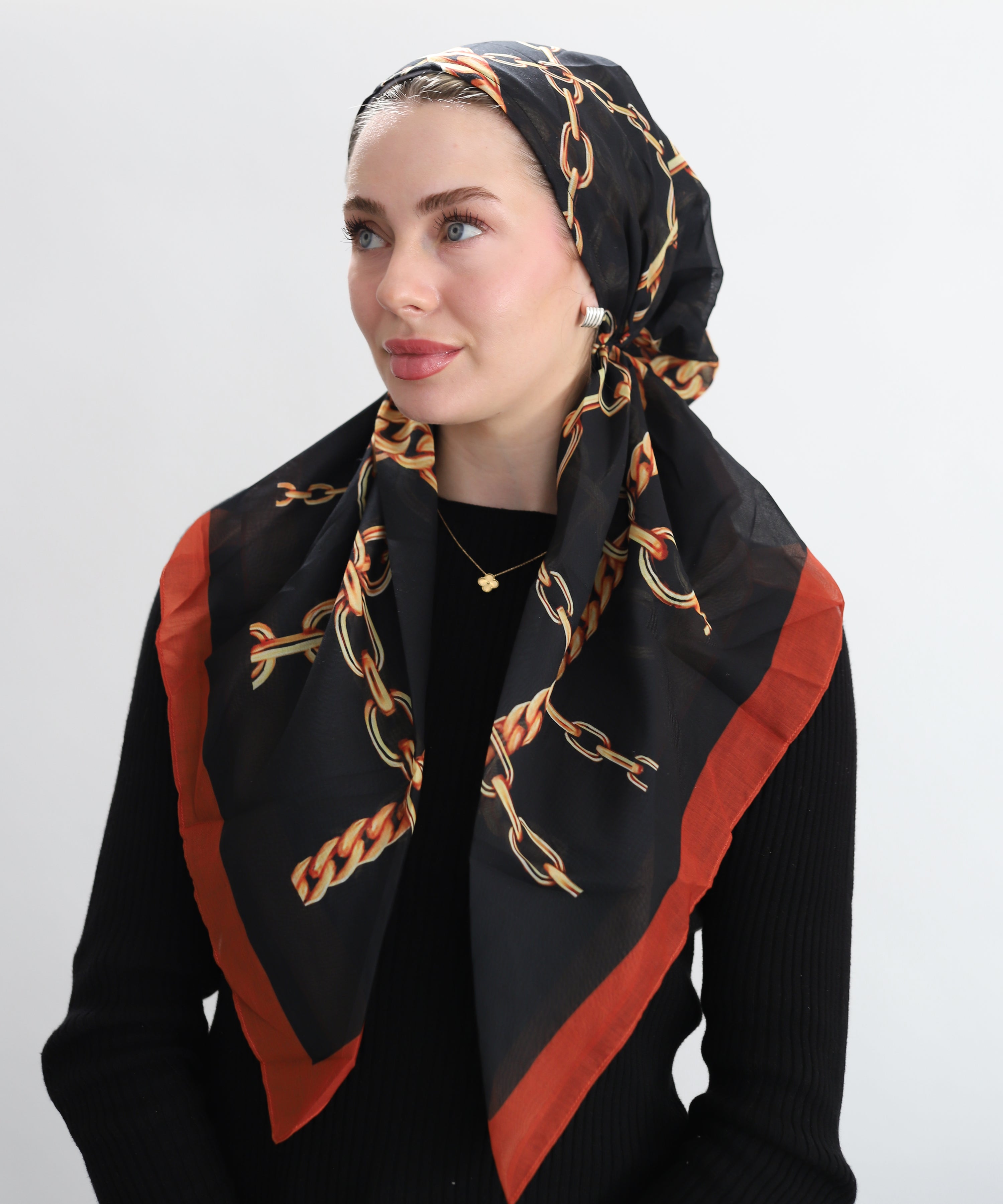 Woman wearing TUK Ironed Out headscarf  — the gold chains, the belt details, the fall colors… it’s so good.