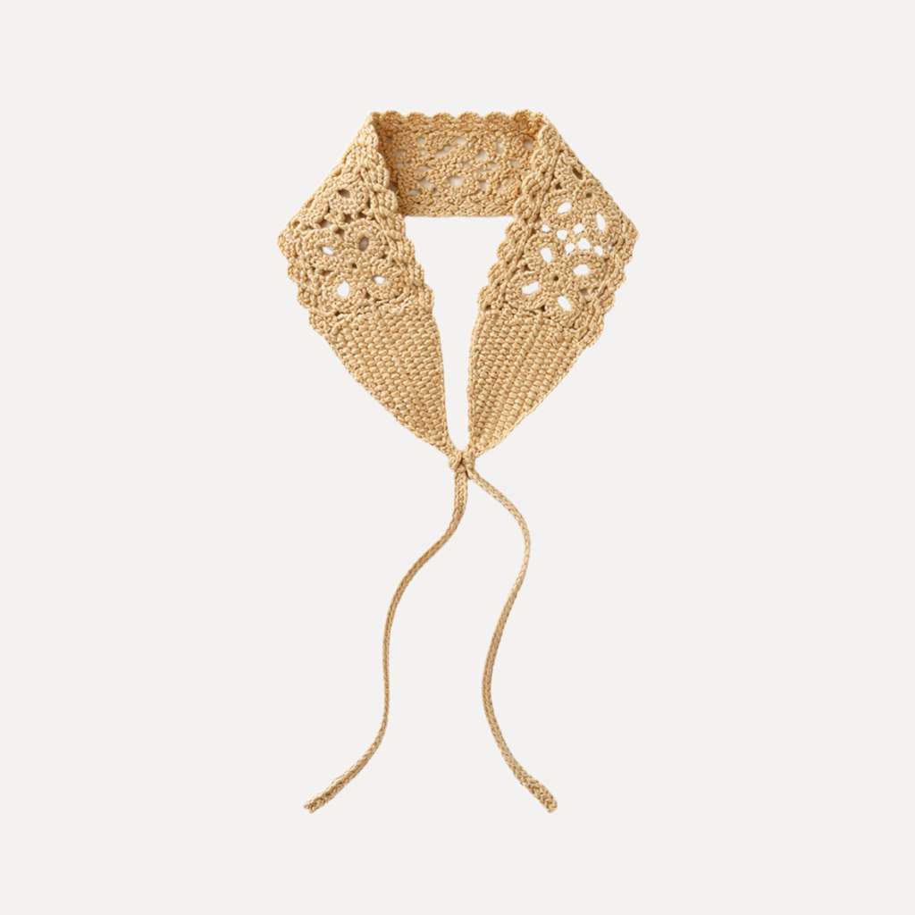 Ivory crochet headband with lace detail and adjustable ties, handmade boho-style hair accessory in soft neutral yarn.