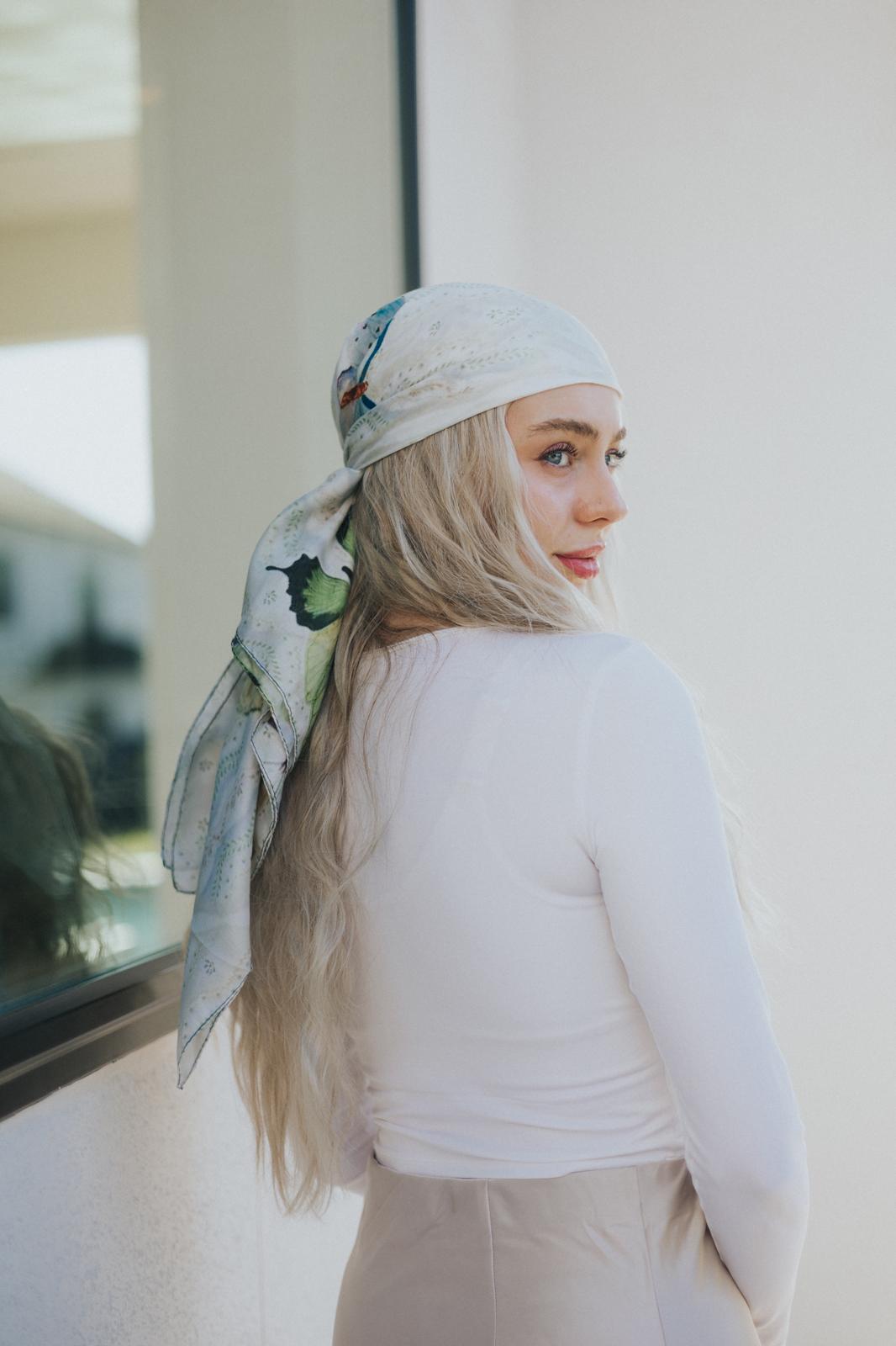 The light ivory base enhances the hand-illustrated look of the floating wings, bringing ethereal charm to your styling. 