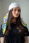 Delicate lemon and floral motifs framed by a bold border print.