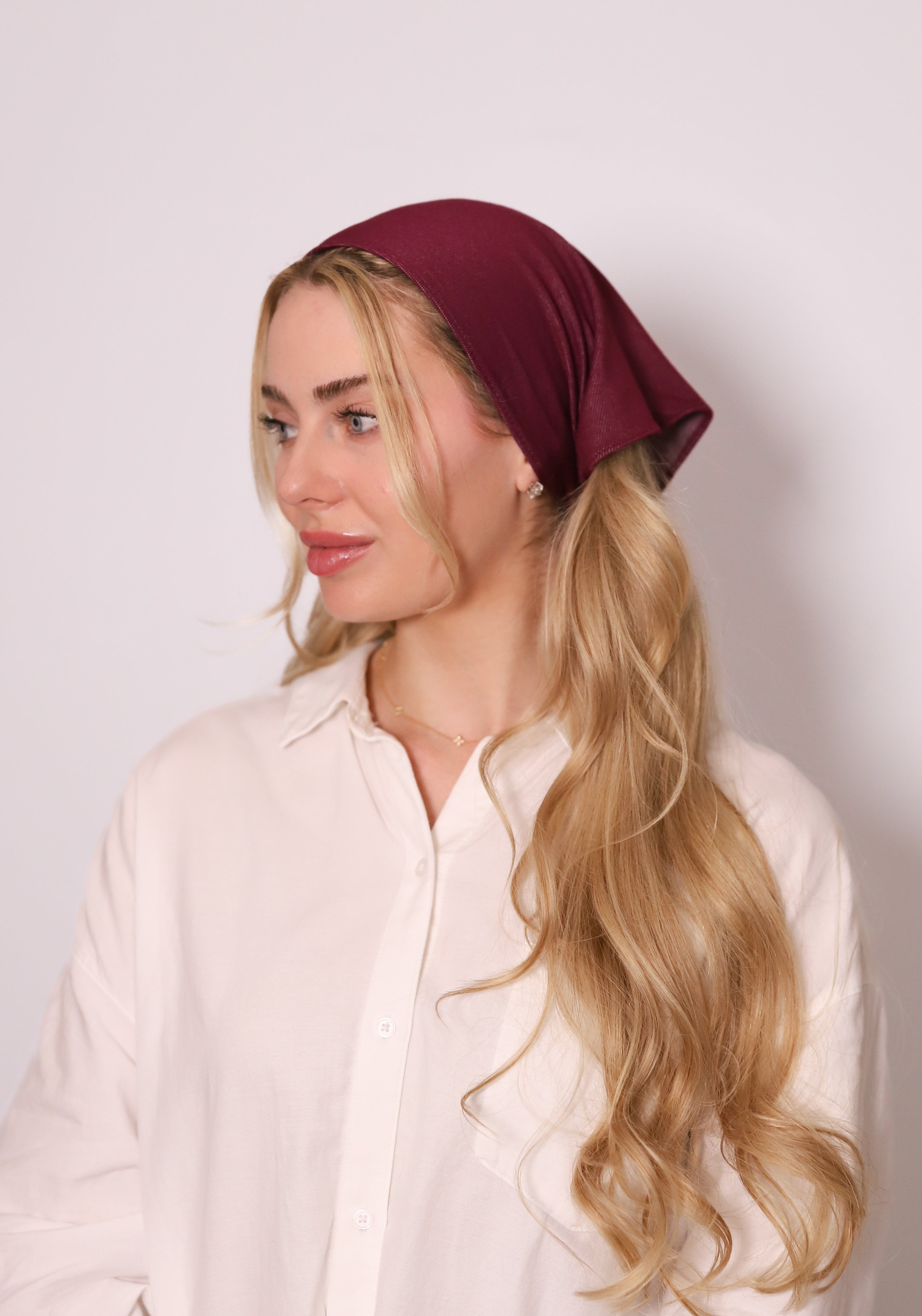 Model wearing TUK's Merlot Denim Bandana in rich burgundy denim, styled as a chic headscarf for everyday fashion.