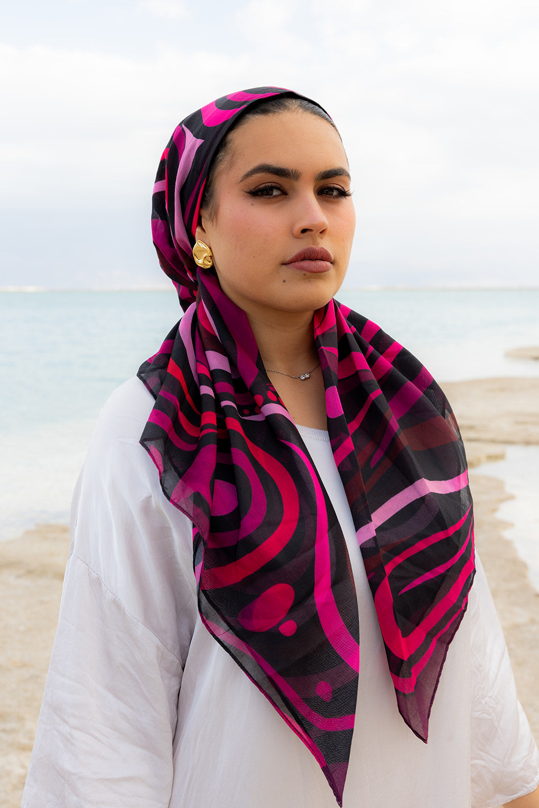 TUK Mind Over Matter Head Scarf featuring vibrant pink and black abstract swirls on a lightweight, stylish head scarf design.