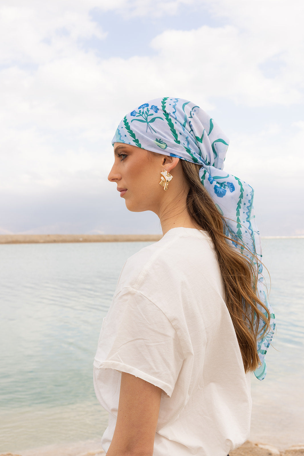 TUK Mint Condition Head Scarf in blue and mint floral print, tied elegantly with flowing tails for a chic coastal style.