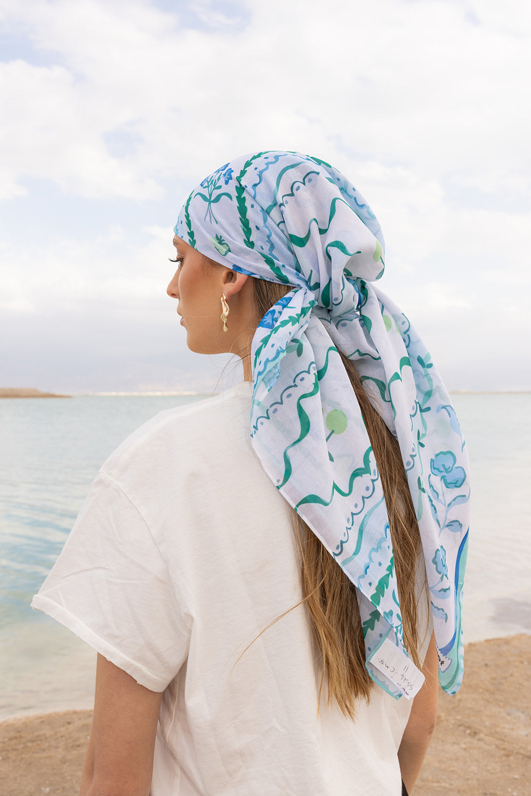 TUK Mint Condition Head Scarf in blue and mint botanical print, styled with long ties for an elegant seaside look.