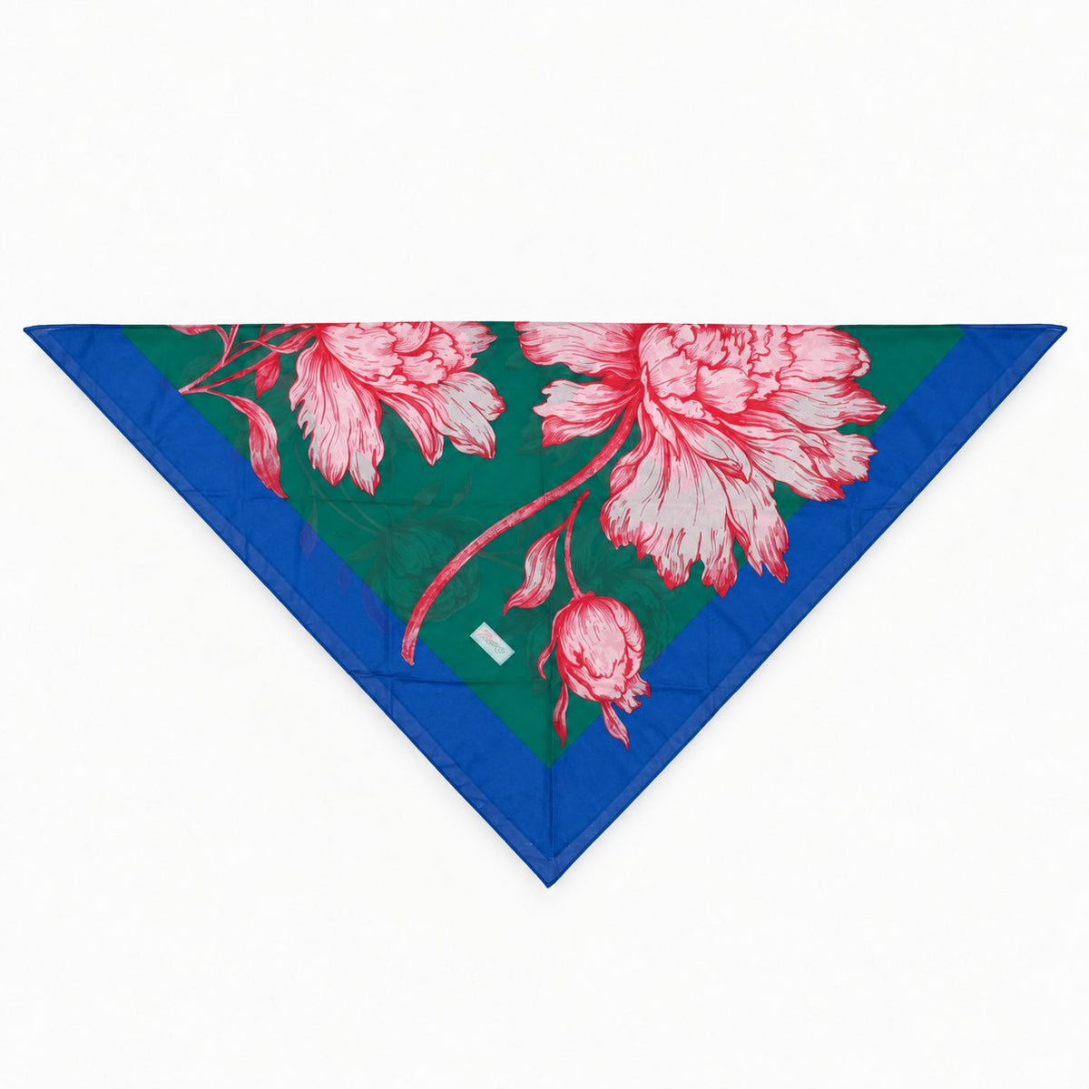 TUK Peony For Your Thoughts Head Scarf folded in a triangle, featuring pink peony blooms on emerald green with a royal blue trim.