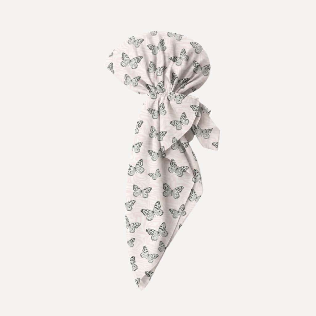 Pink Haze Pre Tie head scarf with black butterfly print on blush pink fabric, stylish women’s pre-tied hair accessory.