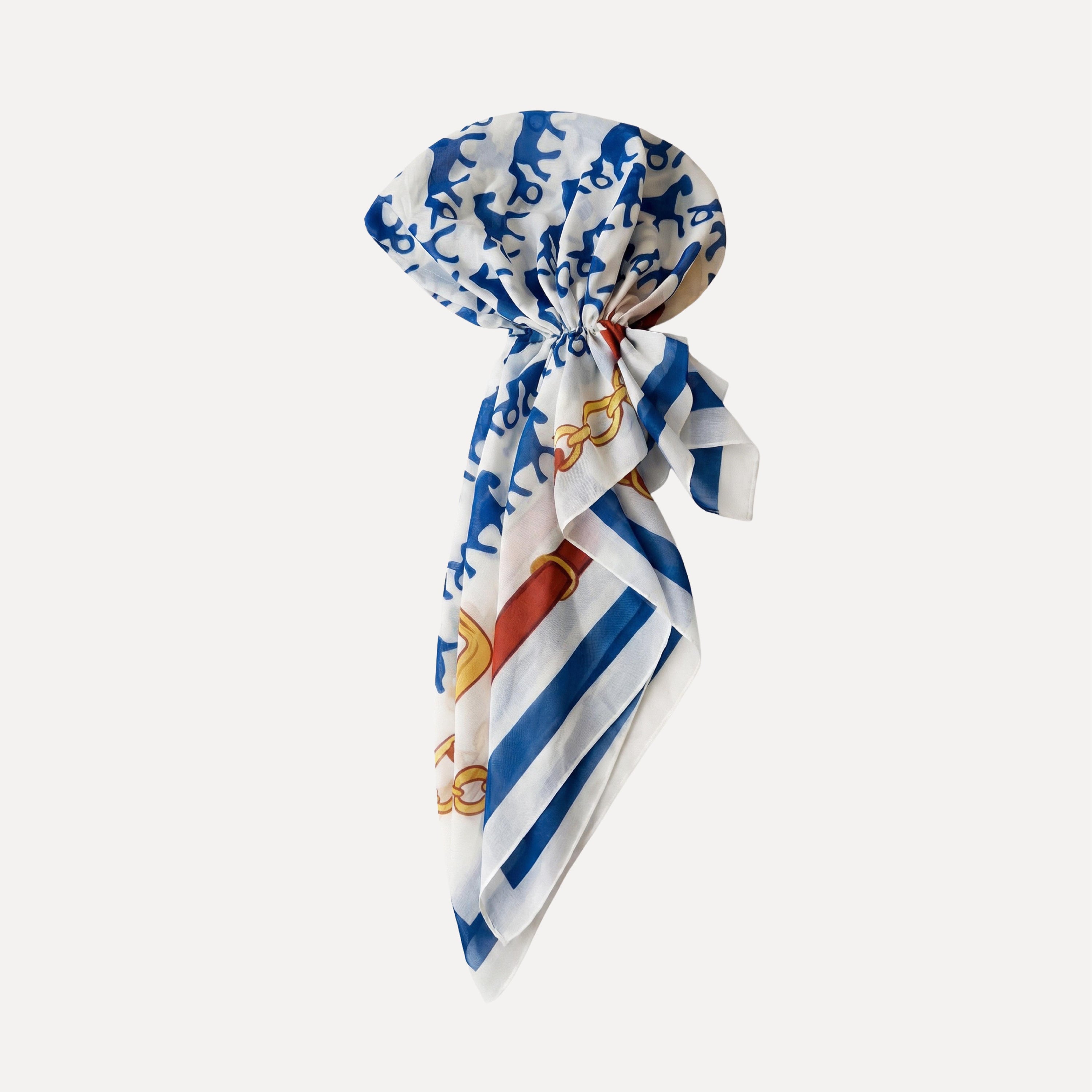 Tie Ur Knot Rein It In headscarf styled pre-tied with blue horse print and chain accents on a chic cream silk scarf elegant look.