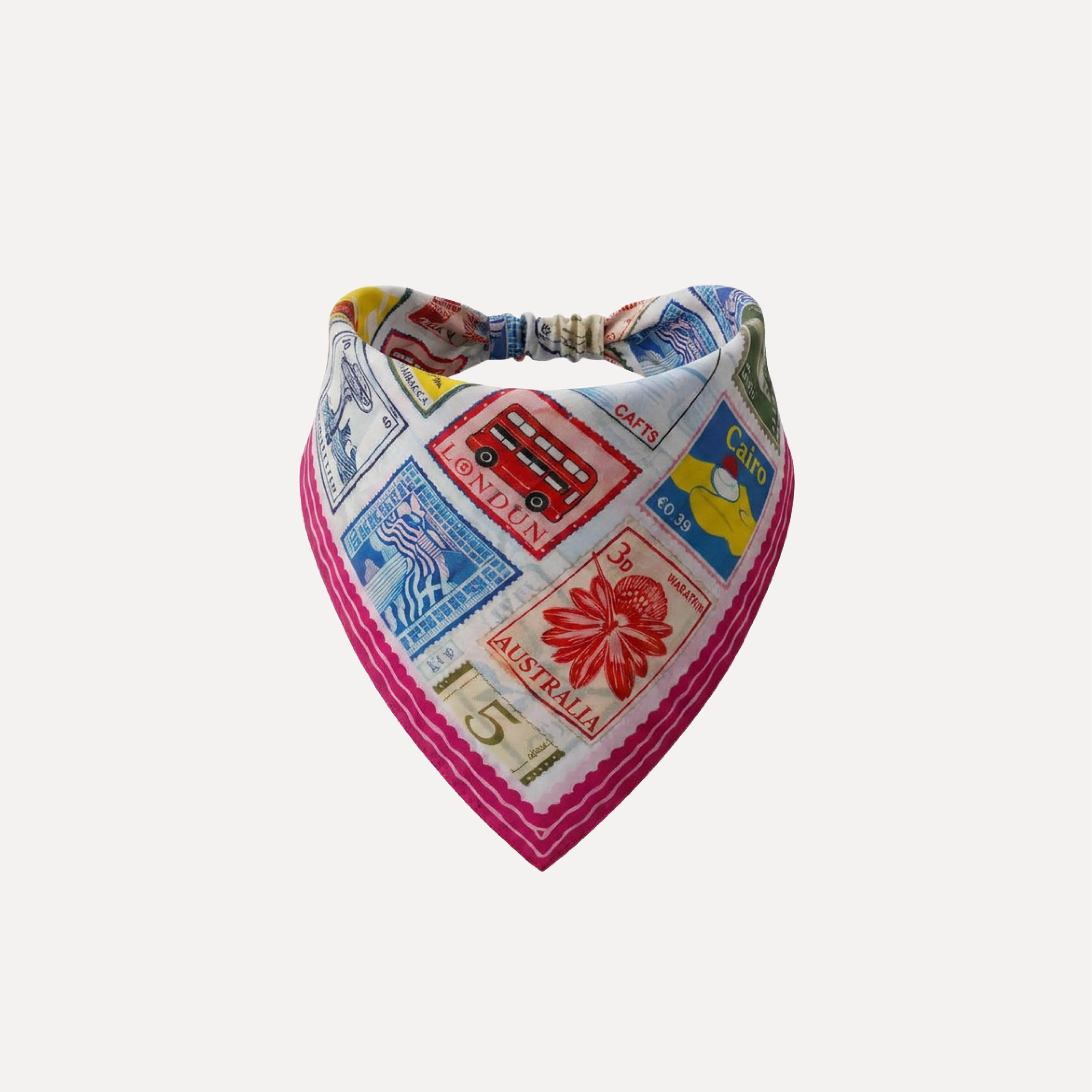 Return To Sender headband bandana with colorful vintage postage stamps, London bus and travel print elastic hair accessory.
