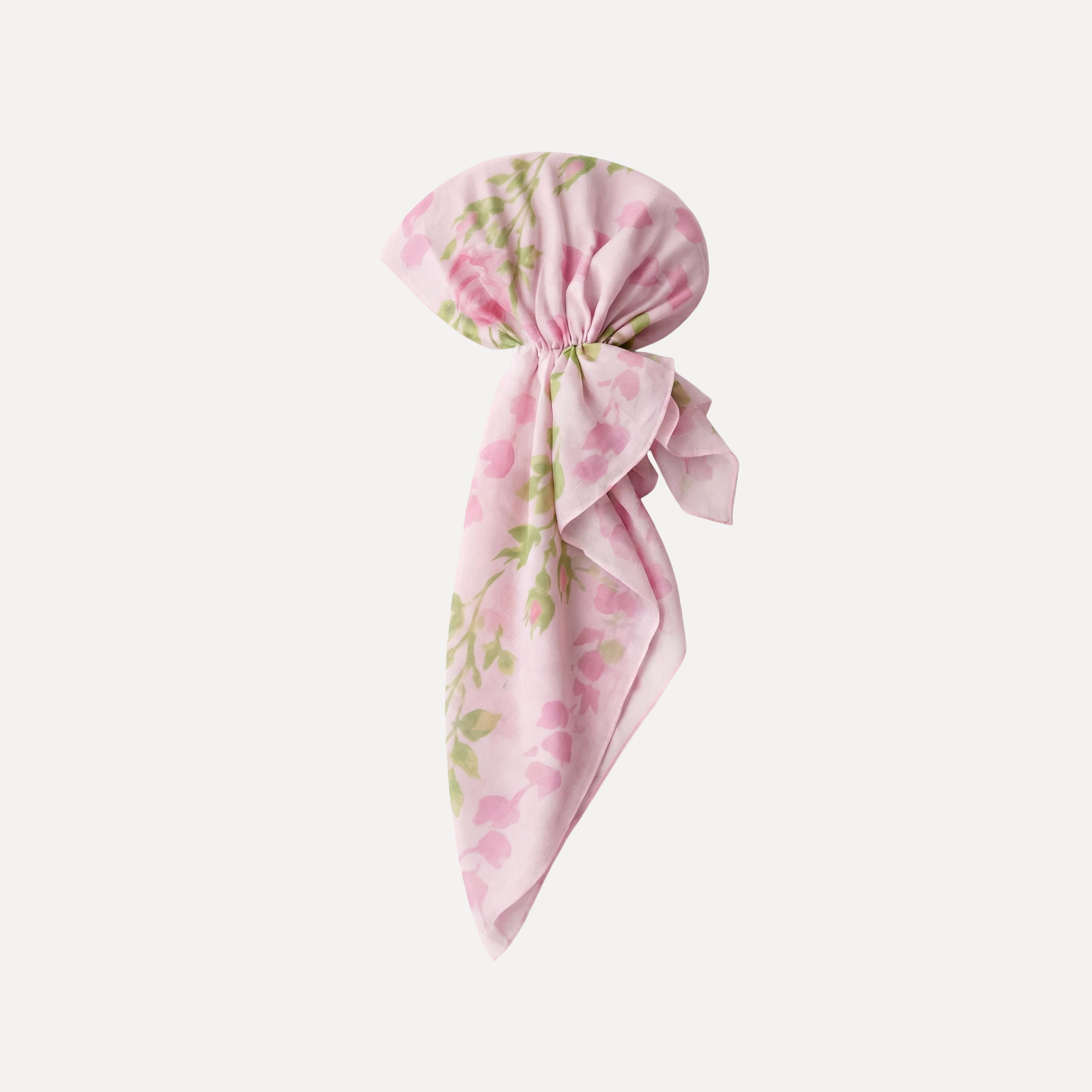 Pink floral pre-tied adjustable headband bandana with soft rose print, lightweight fabric, and elegant bow detail by TUK.