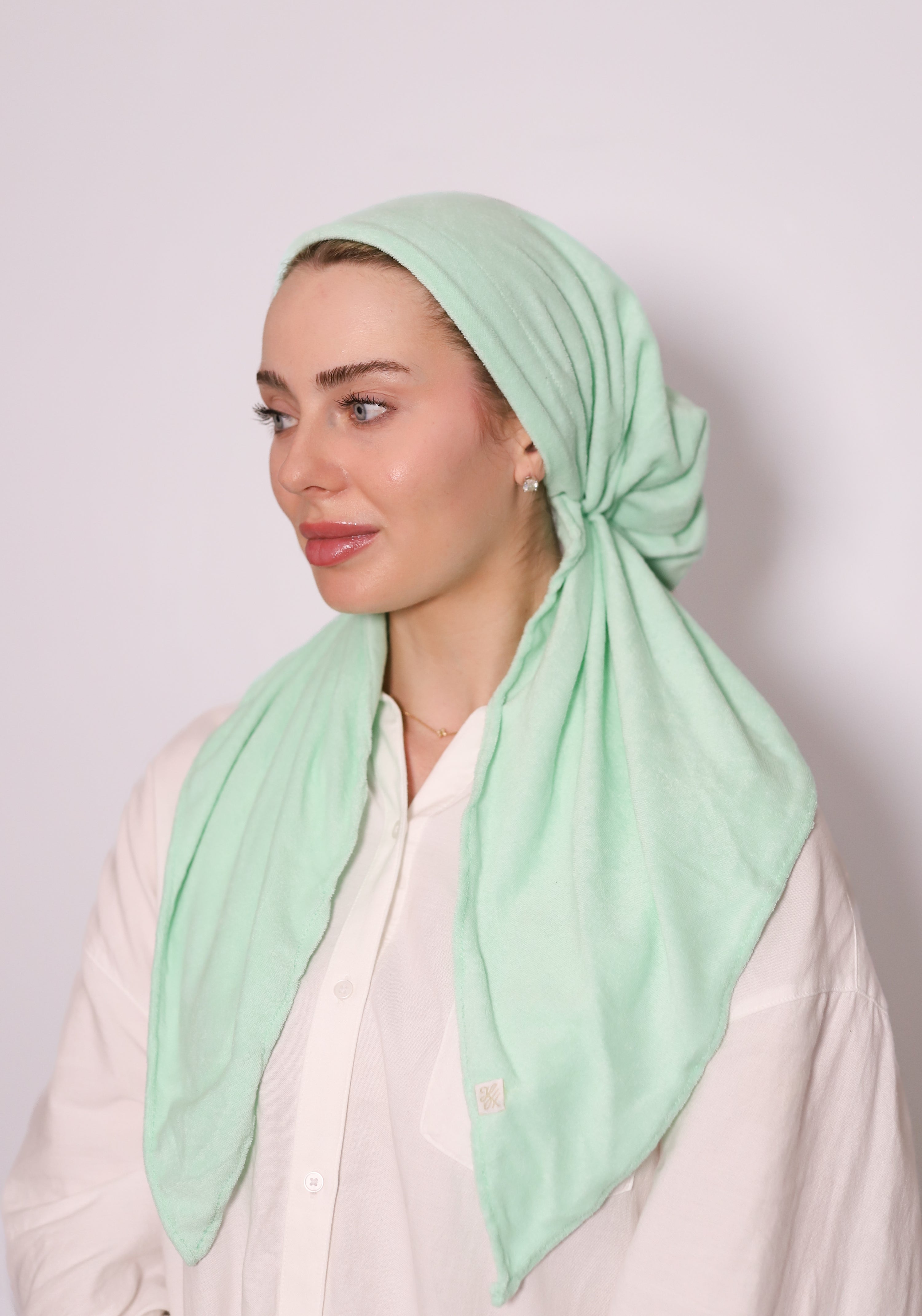 Seafoam Terry Head Scarf by TUK in soft mint green terry fabric, styled as a comfortable modest headscarf with elegant drape.