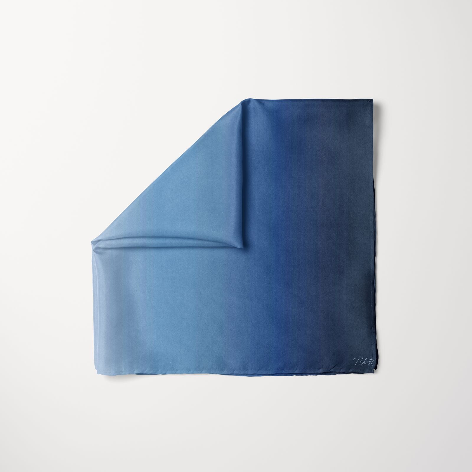TUK Soft Serve Pre-tied Head Scarf in silky fabric with a smooth blue ombré gradient, offering effortless style and modern elegance.