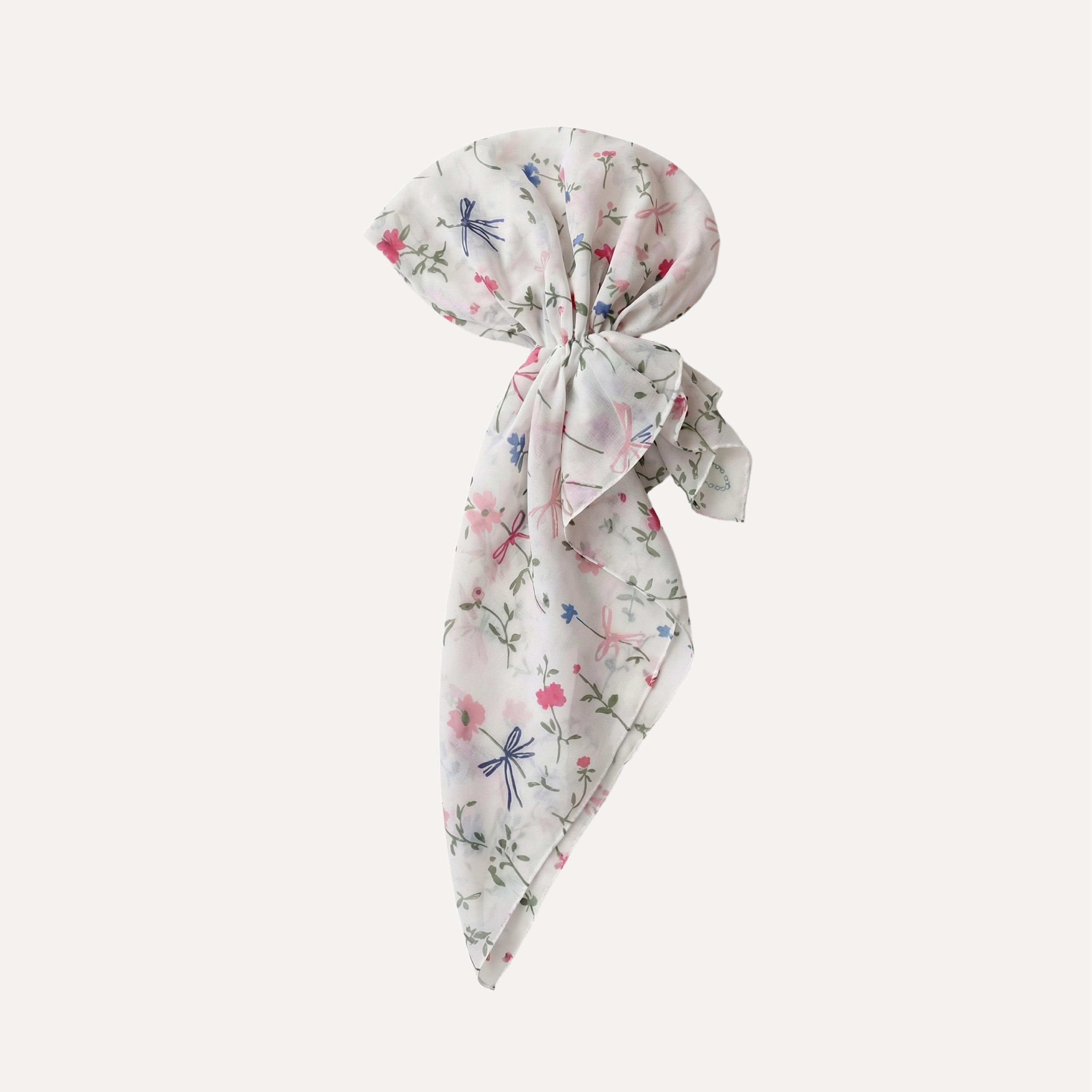 TUK Spring Thing Head Scarf pre-tied style with soft floral and bow print, lightweight cream fabric, feminine spring hair accessory.