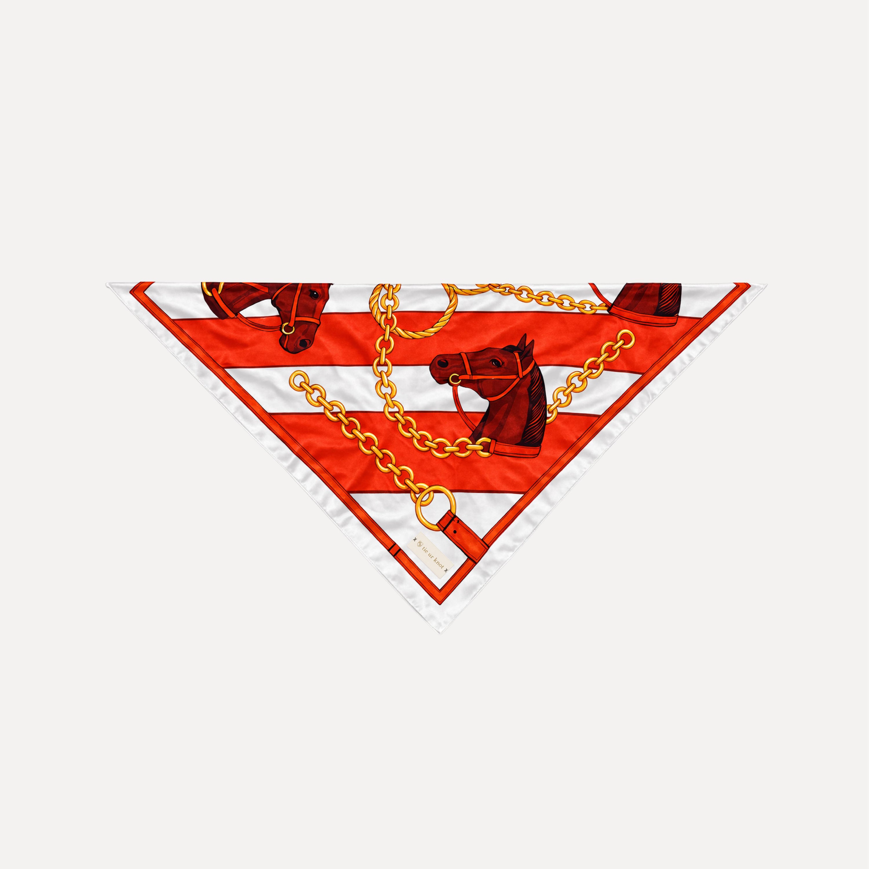 Stirrup Society silk scarf by TUK featuring red stripes, horse heads, and gold chain equestrian print on luxury silk square
