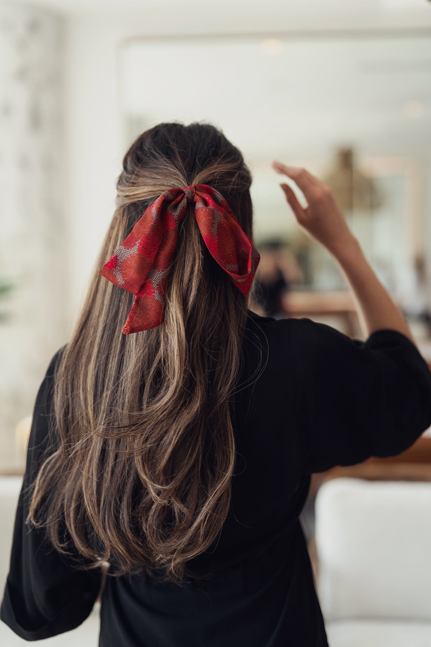 Pink and red flower-print ribbon with black-and-white grid accents