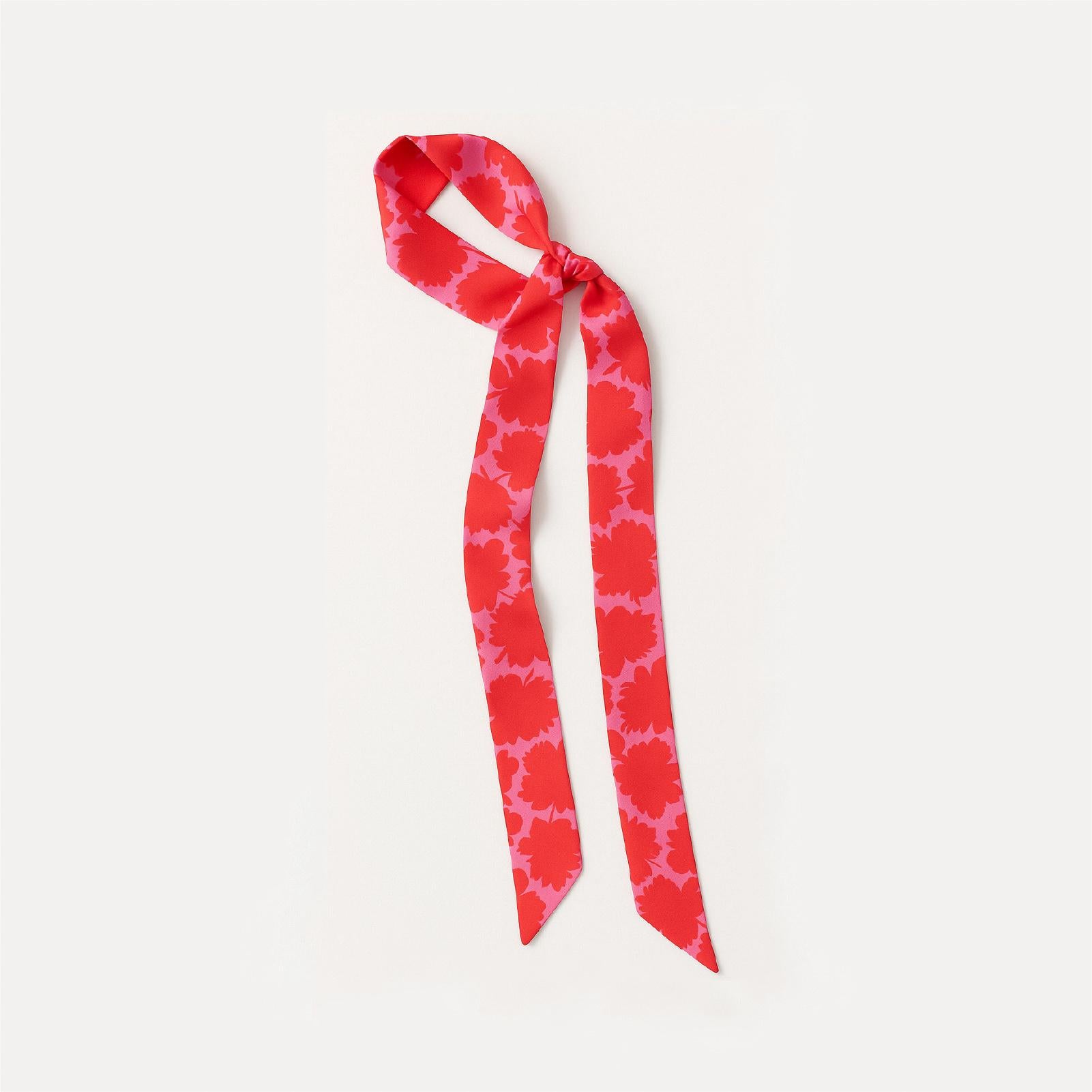 Bright pink ribbon with bold red floral print