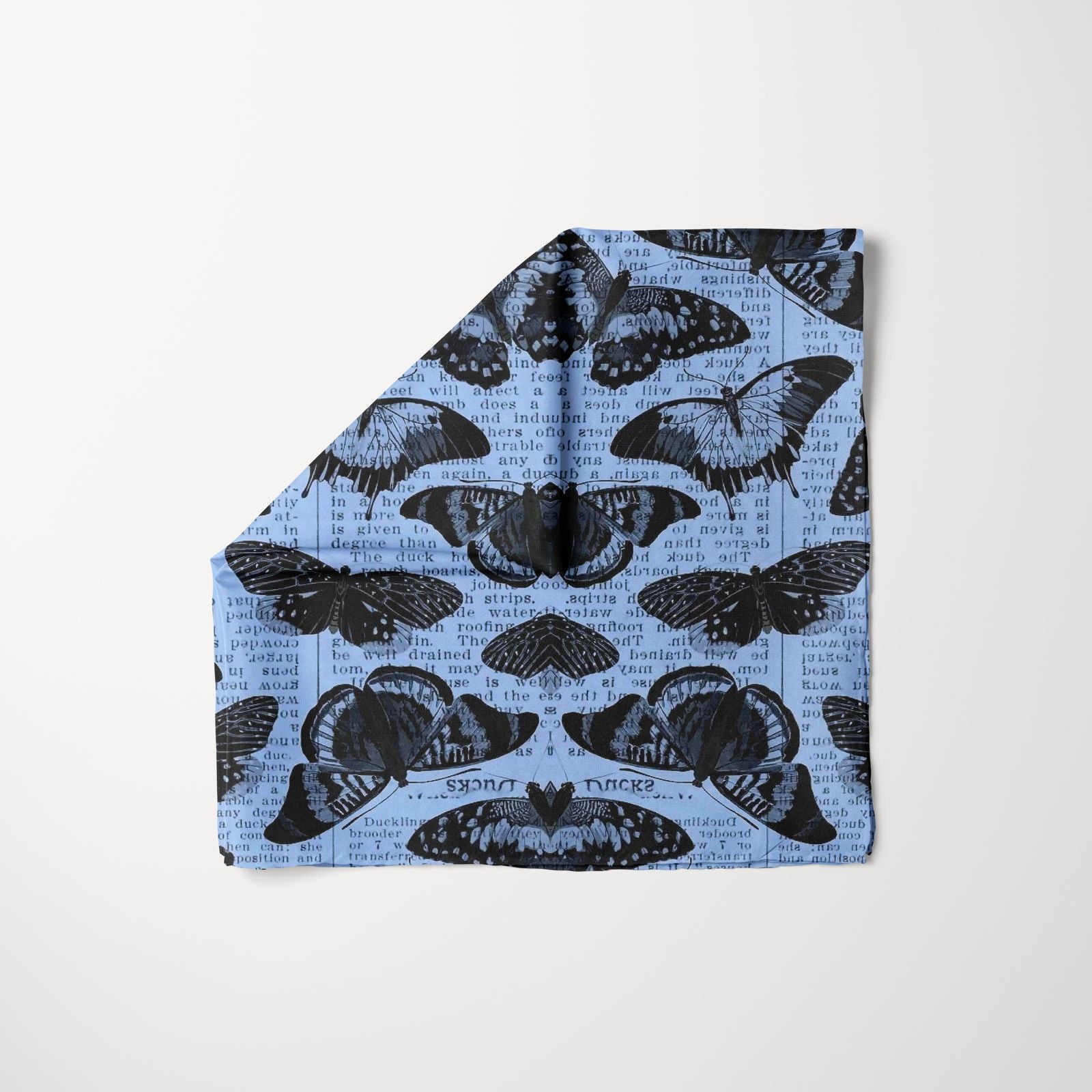 T.U.K. Typecast Head Scarf featuring black butterfly motifs over vintage typewriter text on a blue fabric for a bold gothic look.