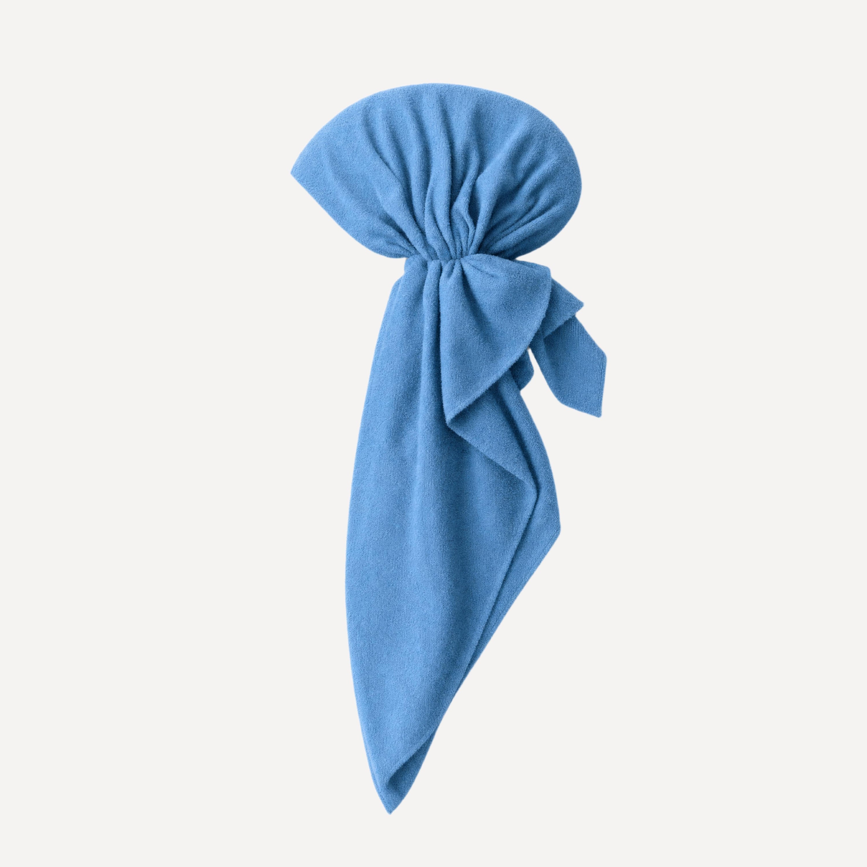 Soft washed denim terry head scarf in blue with gathered knot detail, lightweight drape, and modern streetwear styling.