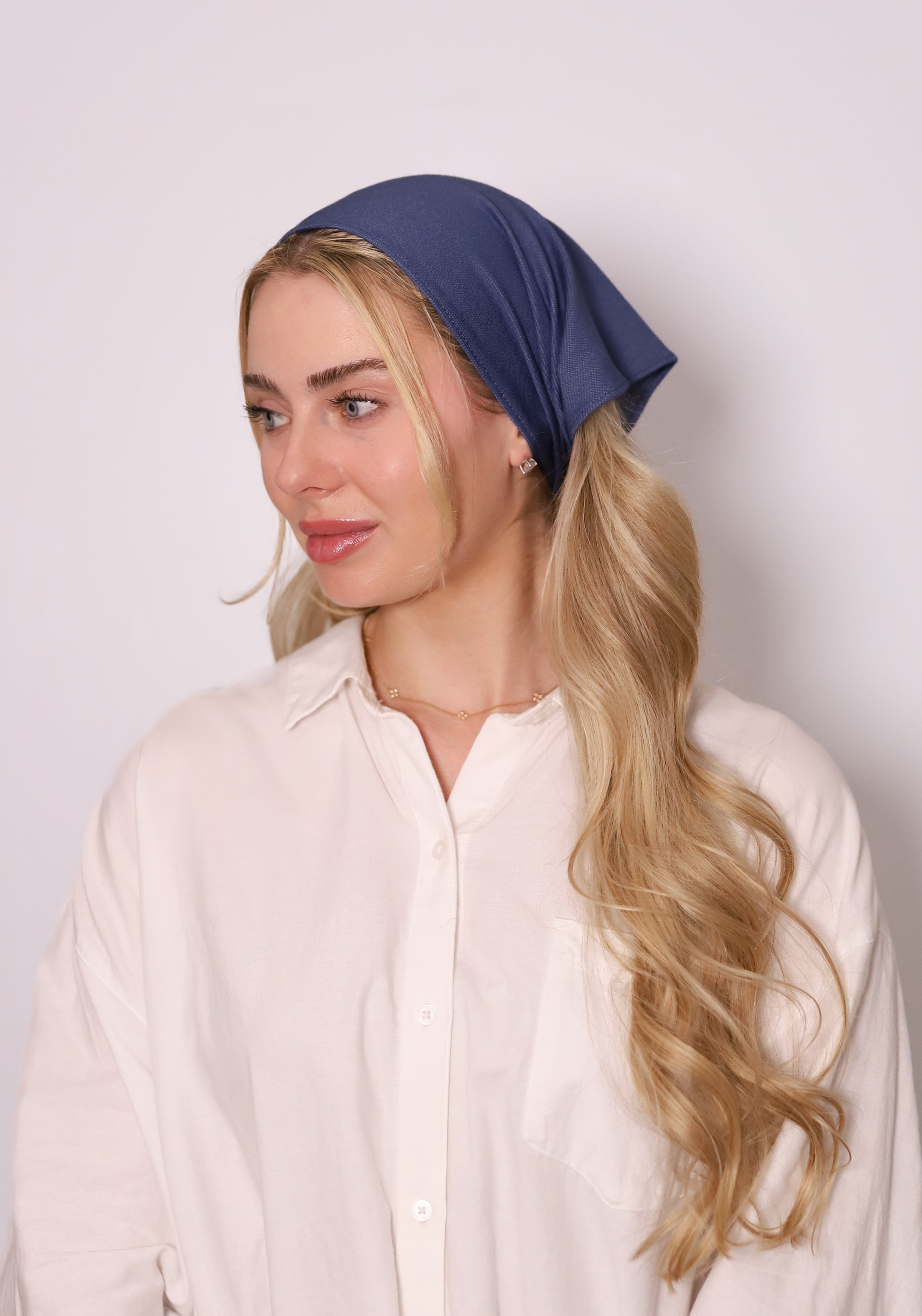TUK Washed Indigo Denim Bandana styled as a headscarf, featuring premium indigo denim fabric and a modern minimalist look.