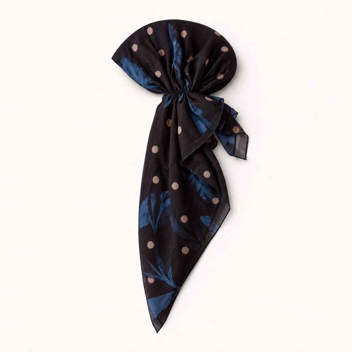 TUK Blue Velvet Head Scarf with blue floral prints and peach polka dots on dark fabric, styled in a chic pre-tied scarf design.