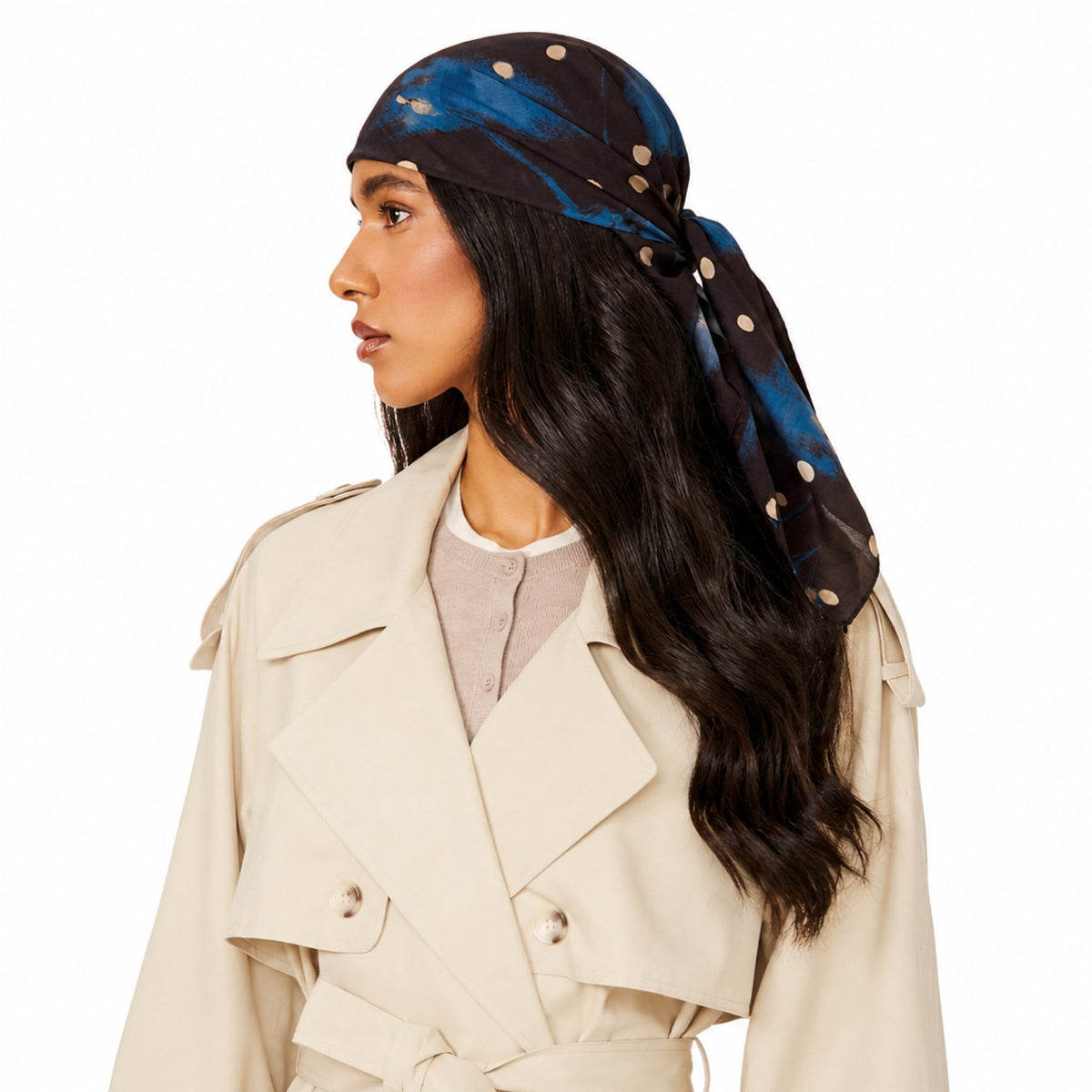 Blue Velvet Head Scarf with a polka dot pattern worn on a woman's head, tied to the back and flowing on her shoulder.