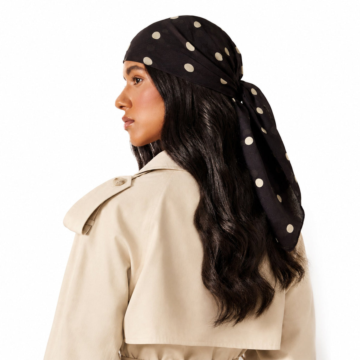 Brown Study Head Scarf worn by a woman, viewed from behind. It is black with large light beige polka dots.