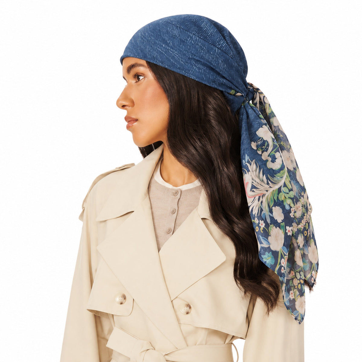Good Genes Head Scarf worn by a person, tied at the back. It is navy blue with a floral pattern.