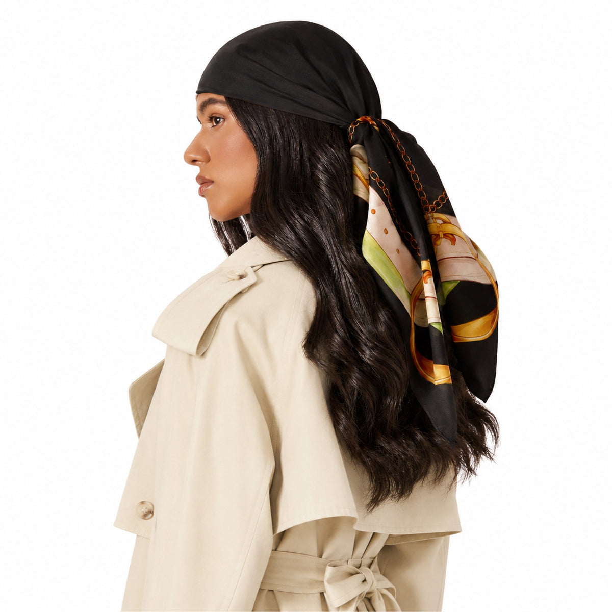 Hold Your Horses Head Scarf in black with a gold chain print, tied at the back of a woman's head.