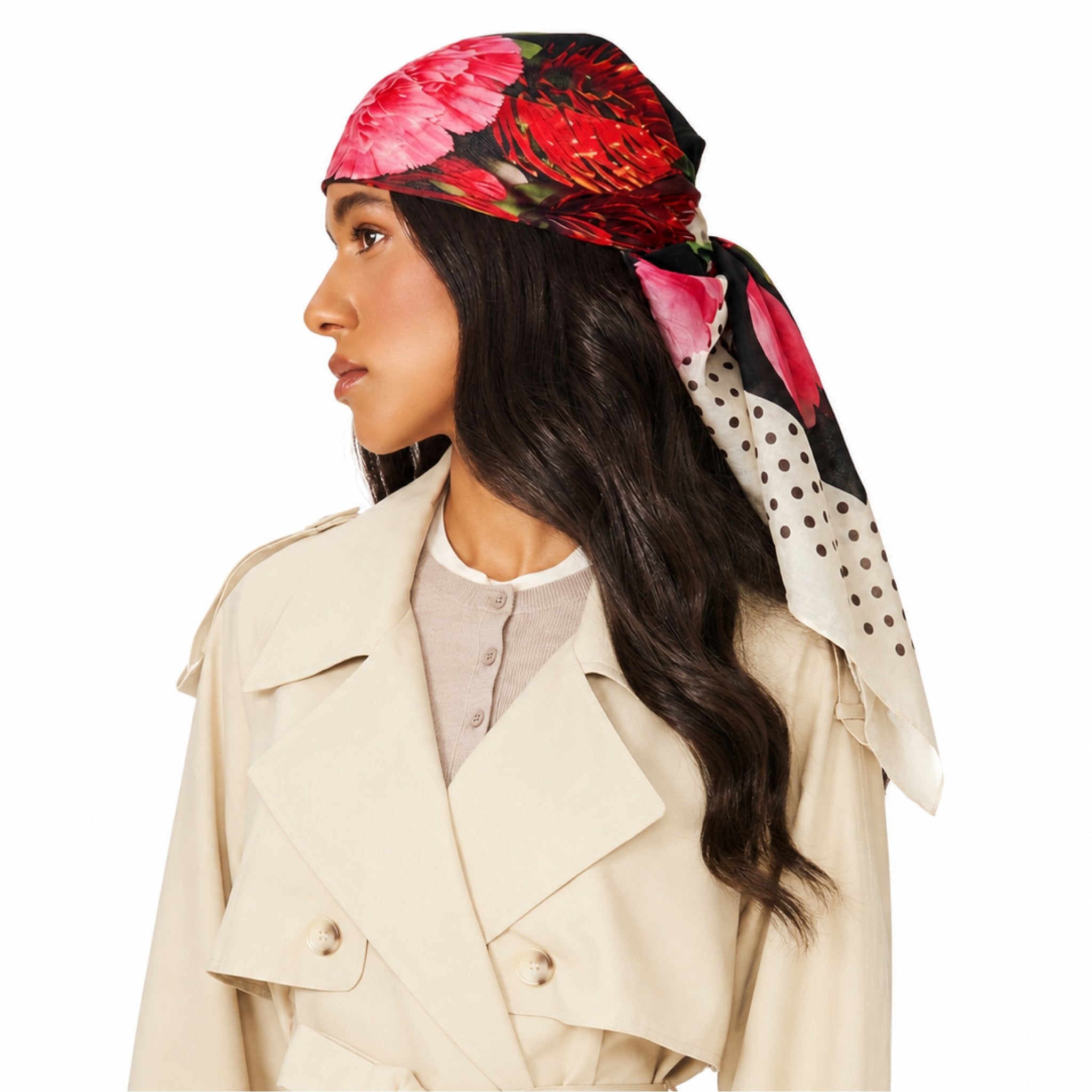 In Full Swing Head Scarf in a white, black, pink and red floral and polka dot pattern worn on a woman's head.