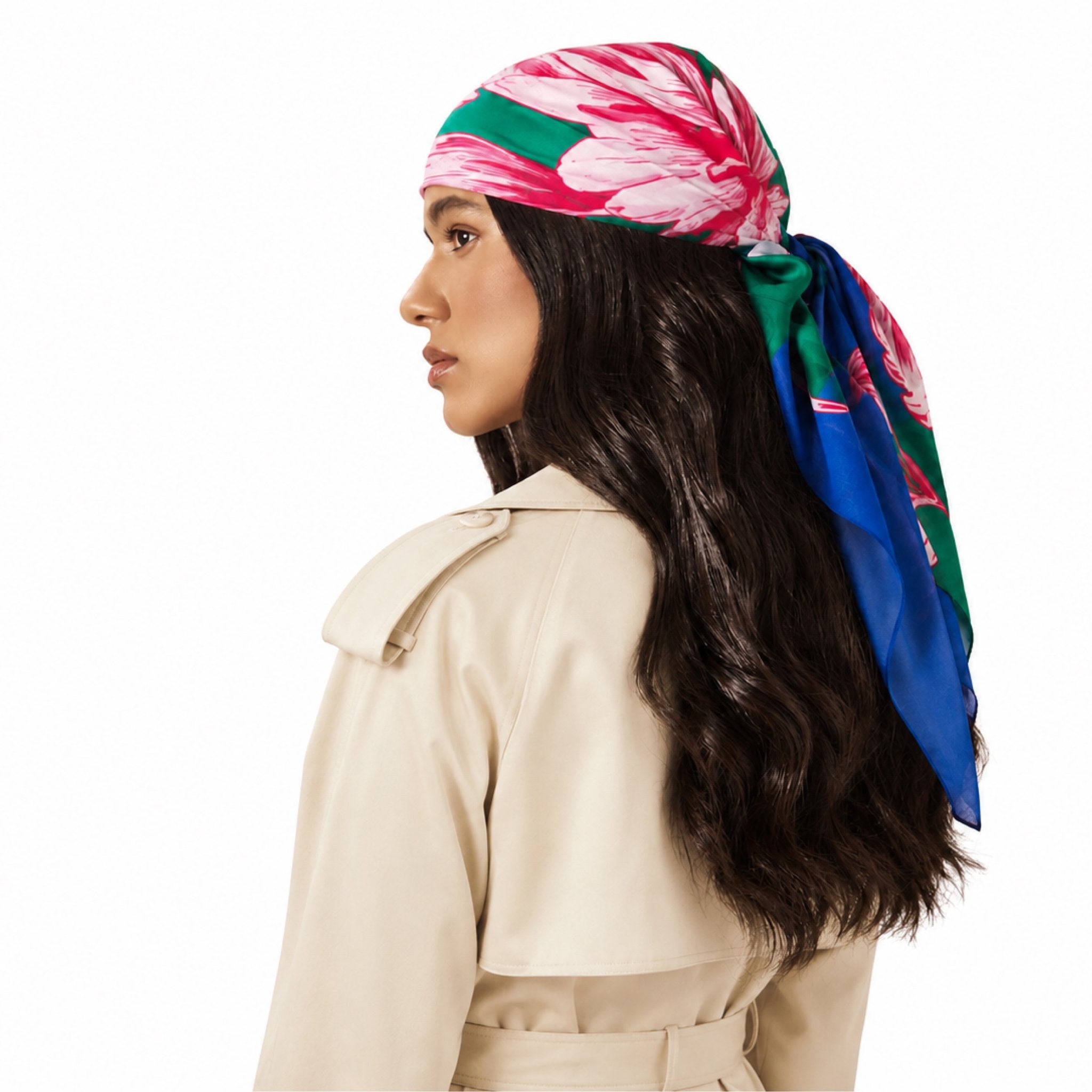 Peony For Your Thoughts Head Scarf worn by a woman with long dark hair. The scarf has a pink and white floral pattern on a